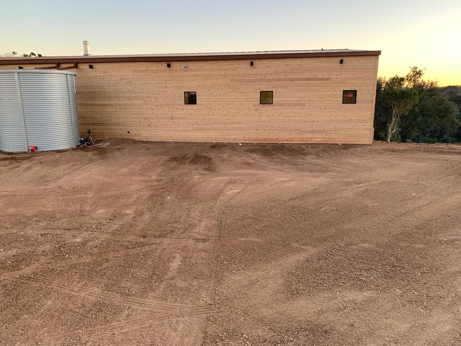 The finished cedar elevation at dusk