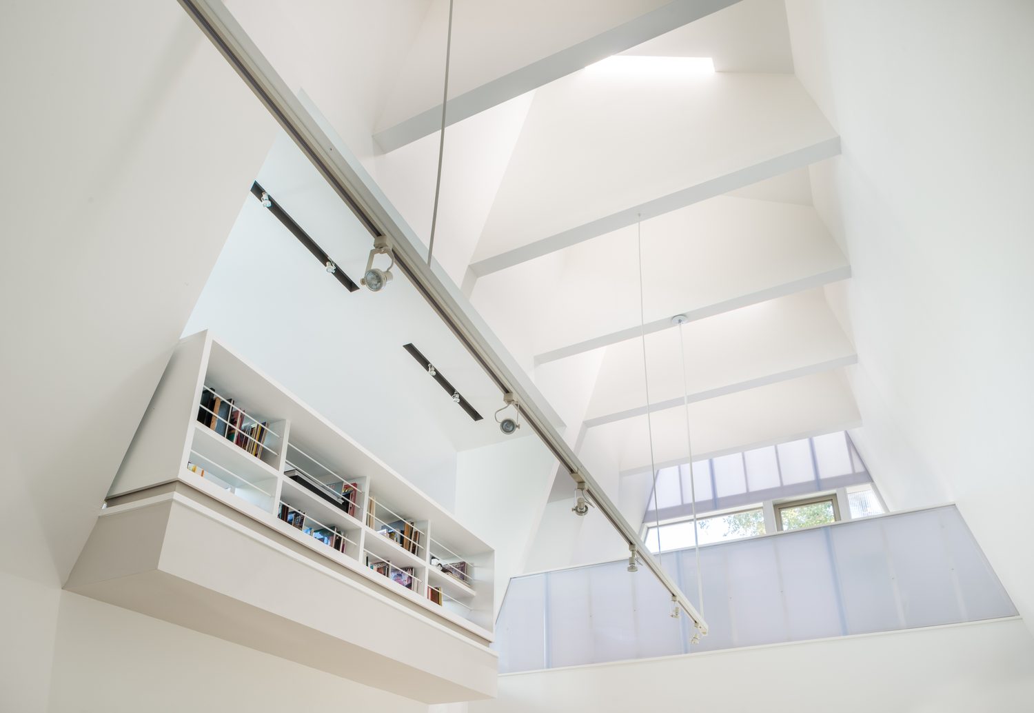 The upper library, its sloping wall carrying a clerestory